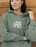 Load image into Gallery viewer, Hoodie: Jesus Holds It All
