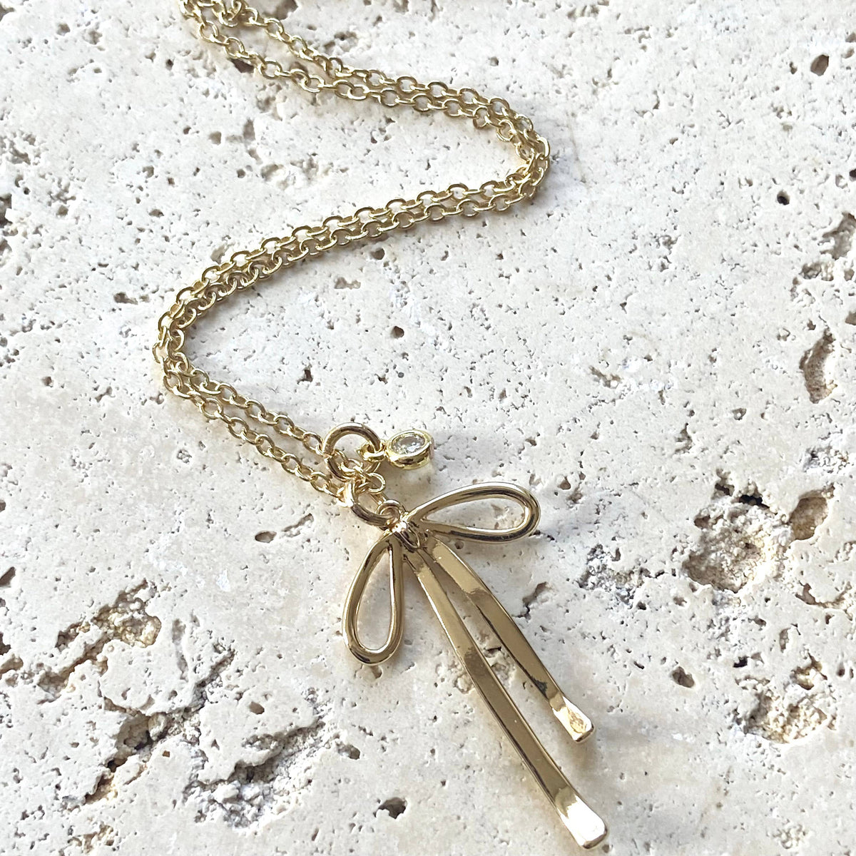 Droopy Ribbon Necklace: Melted Droopy Ribbon Bow Charm Necklace – HeyPeacock