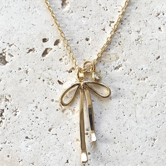 Necklace: Melted Droopy Ribbon Bow Charm Necklace
